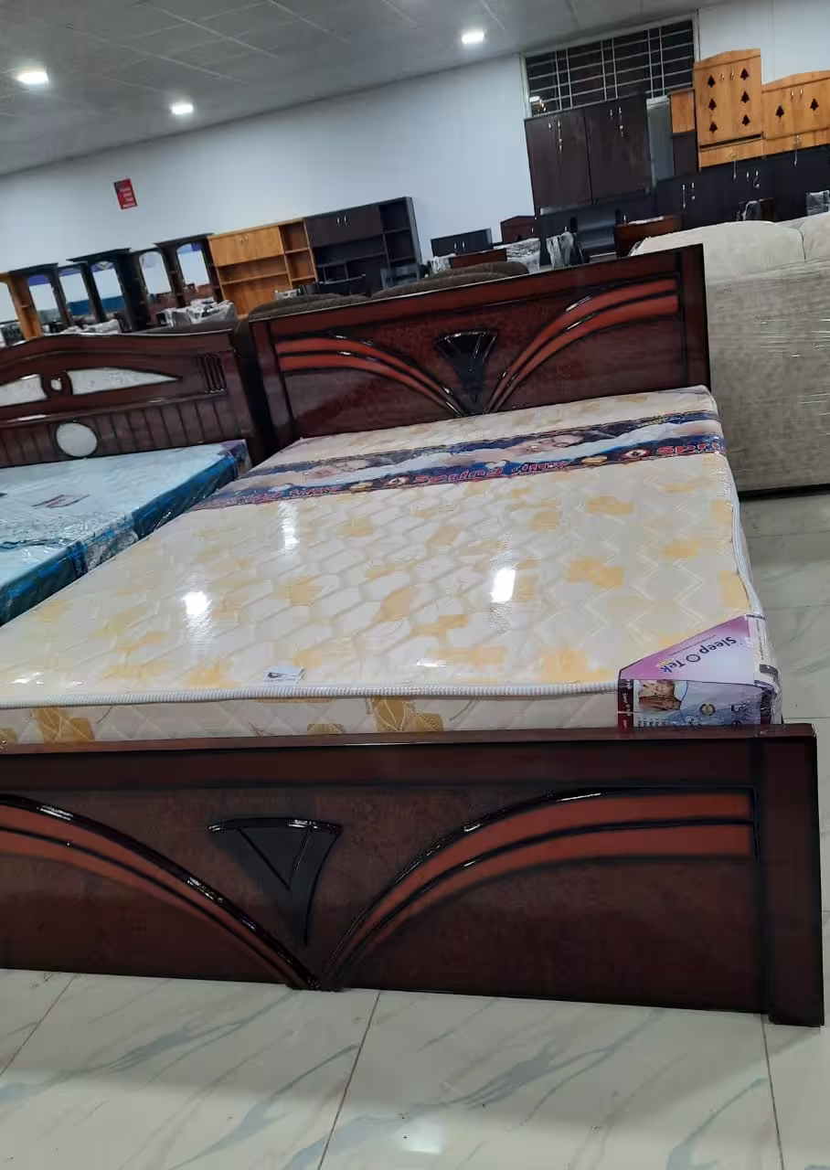 Contemporary dark walnut finish wooden bed with clean lines and full under-bed storage space.